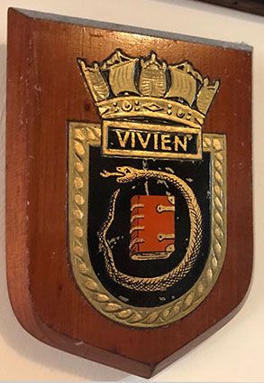 HMS Vivien's badge, showing the serpent surrounding the book, symbol of Vivien of Arthurian legend. We would love to find out where the larger badge presented to Bromyard UDC in 1941 ended up.