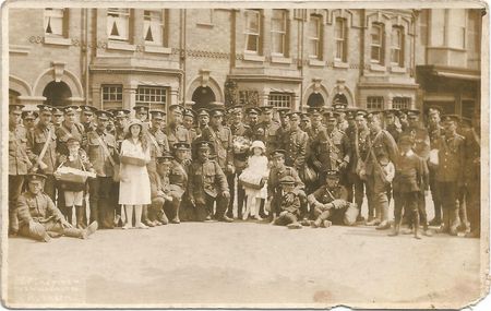 Soldiers and locals in Wellingborough St, Rushden 1914.
